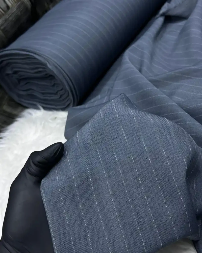 Grey Pinstripe Worsted Wool Suiting fabric on the roll
