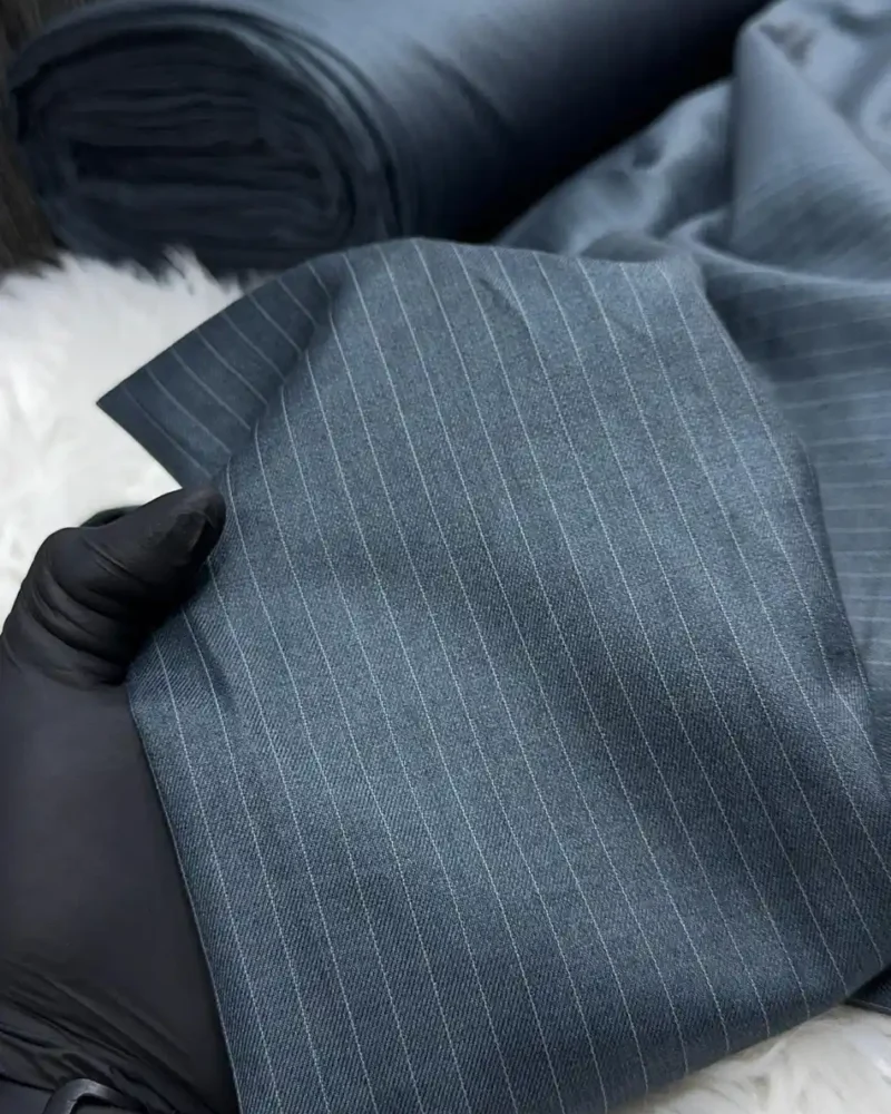 Silver Pinstripe Worsted Wool Suiting fabric on the roll